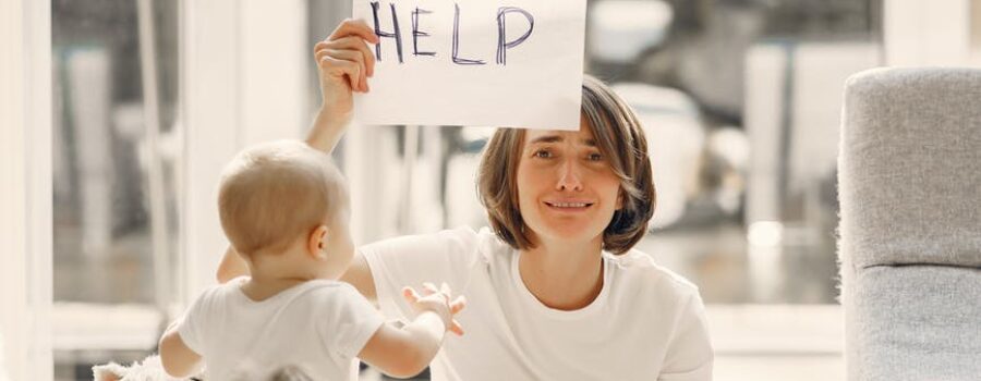 tired mother asking for help while sitting with children